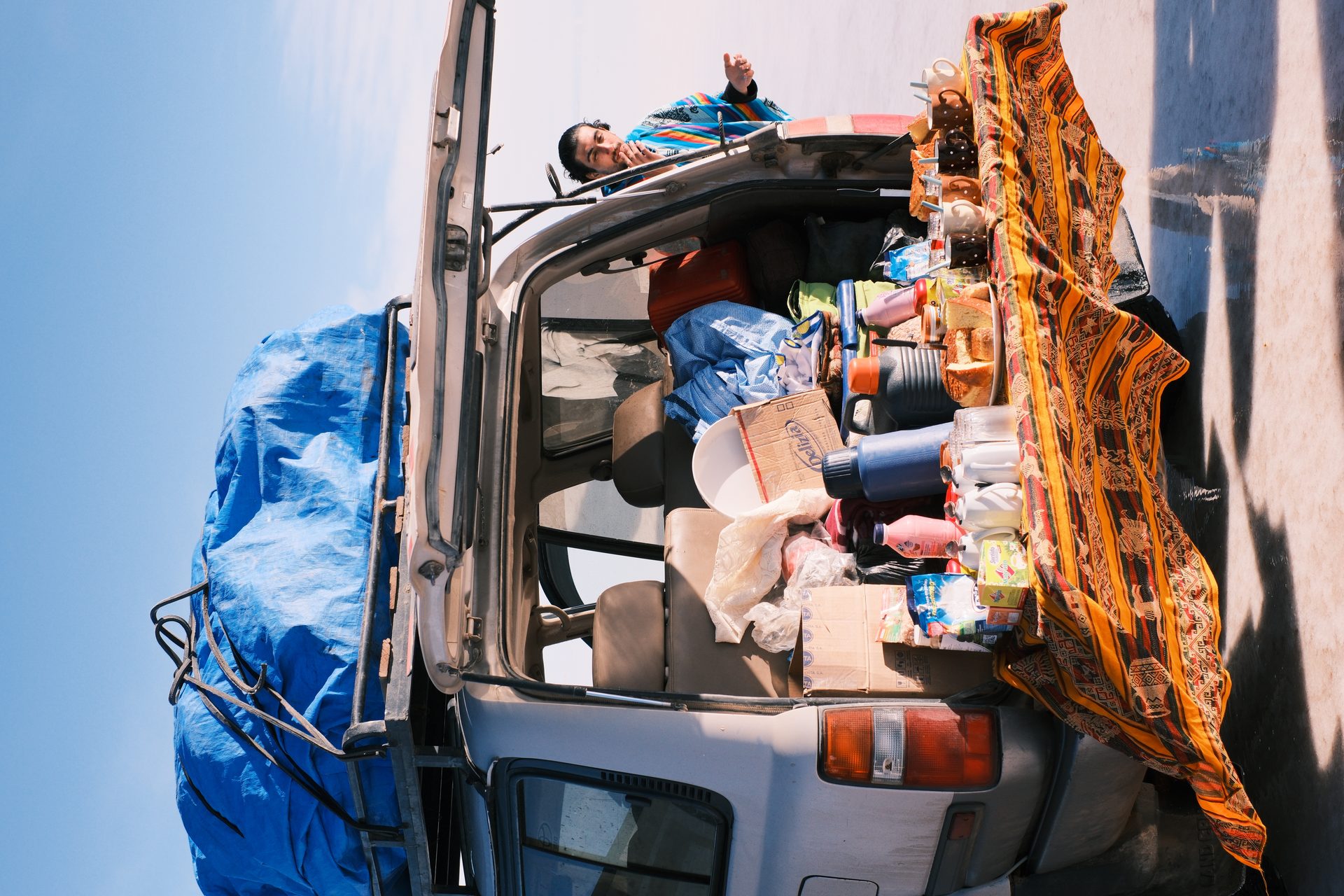 Laguna Colorada at sunrise — flamingos wading in a red salt lake